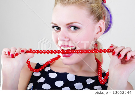Woman beating red chaplet 13052344