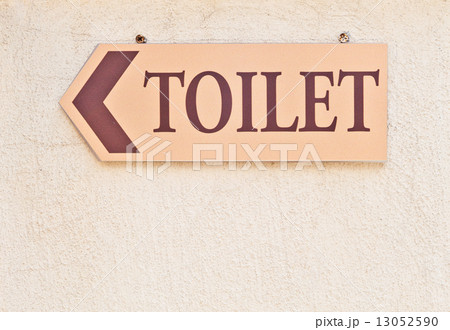 Toilet sign on a wall 13052590