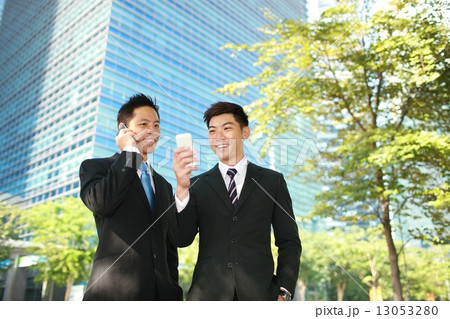 2 Business men on their phones 13053280