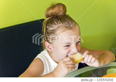 Cute girl eating melon 13054208