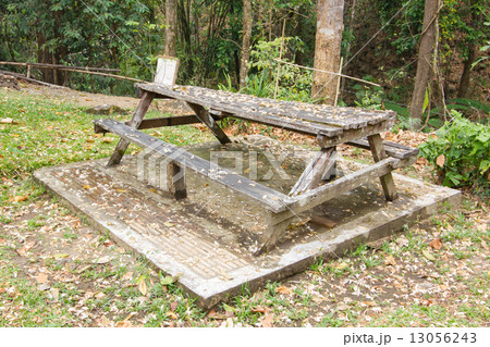 Abandoned wooden bench in thai public park 13056243