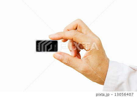 Hand holding very small mobile smart phone with black screen. Is Hand holding very small mobile smart phone with black screen. Is 13056407