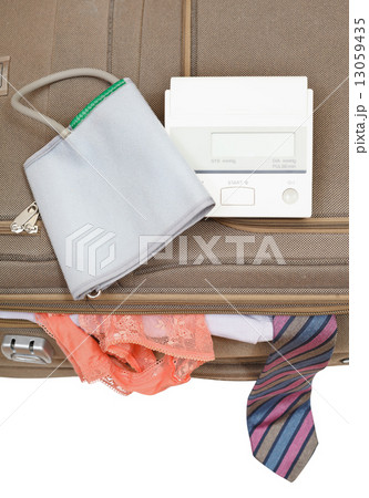 sphygmometer on suitcase with tie and panties 13059435