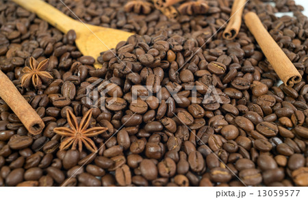Lots of coffee beans. Two anise stars, three sticks of cinnamon. Lots of coffee beans. Two anise stars, three sticks of cinnamon. 13059577
