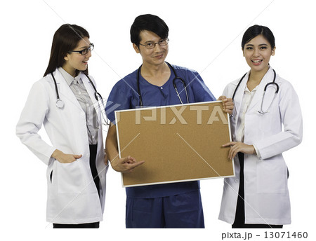 Three Asian Medical Professionals Holding Writing Board Three Asian Medical Professionals Holding Writing Board 13071460
