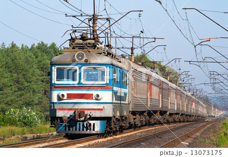 Passenger train hauled by electric locomotive. Ukraine railways 13073175