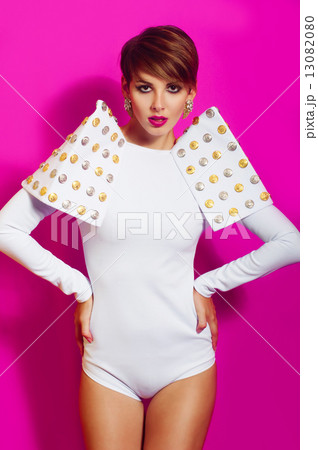 Beautiful girl in a white concert suit on pink background 13082080