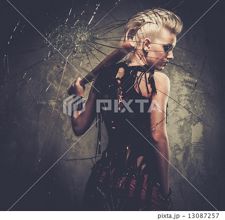 Punk girl behind broken glass with a baseball bat 13087257