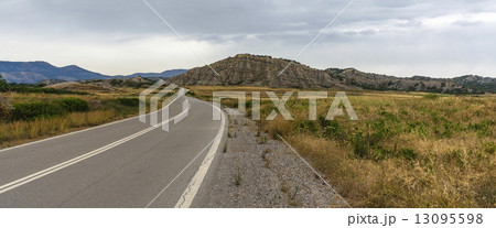 Tarmac road in the hot valley on the Rhodes island 13095598