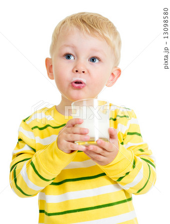 Pretty kid drinking milk from glass 13098580