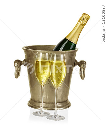 Bottle of champagne in ice bucket with stemware isolated on white background Bottle of champagne in ice bucket with stemware isolated on white background 13100837