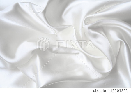 Smooth elegant white silk as wedding background Smooth elegant white silk as wedding background 13101831