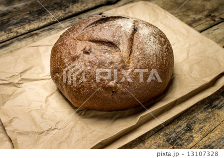 Loaf of rye breadon paper bag 13107328