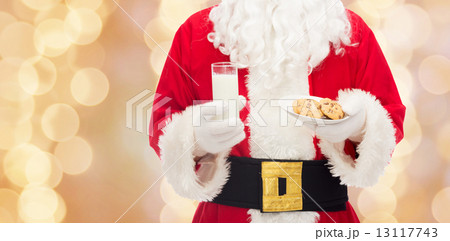 santa claus with glass of milk and cookies 13117743