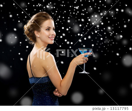 smiling woman holding cocktail smiling woman holding cocktail 13117795