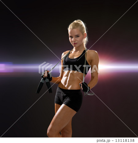 sporty woman with skipping rope sporty woman with skipping rope 13118138