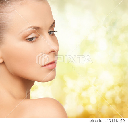 beautiful young woman over yellow background beautiful young woman over yellow background 13118160