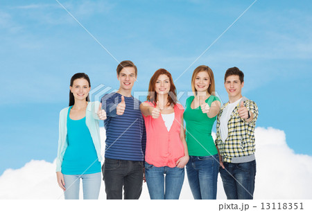 group of smiling students showing thumbs up 13118351