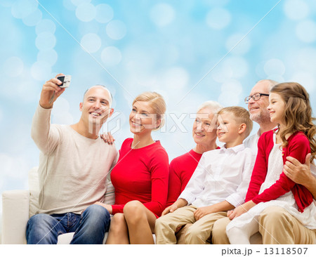 smiling family with camera smiling family with camera 13118507