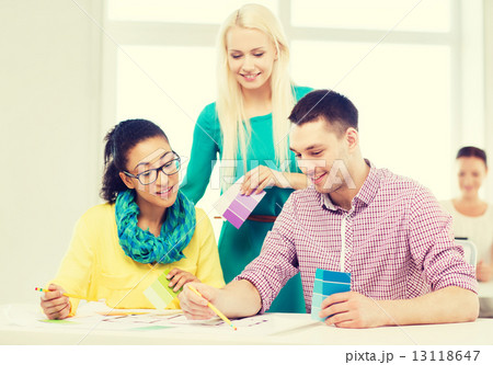 smiling interior designers working in office smiling interior designers working in office 13118647