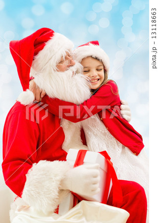 smiling little girl with santa claus smiling little girl with santa claus 13118663