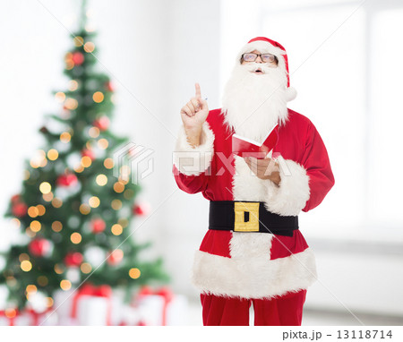 man in costume of santa claus with notepad 13118714