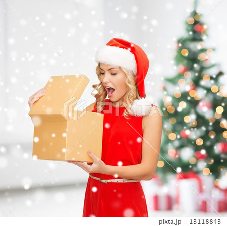 smiling woman in red dress with gift box 13118843
