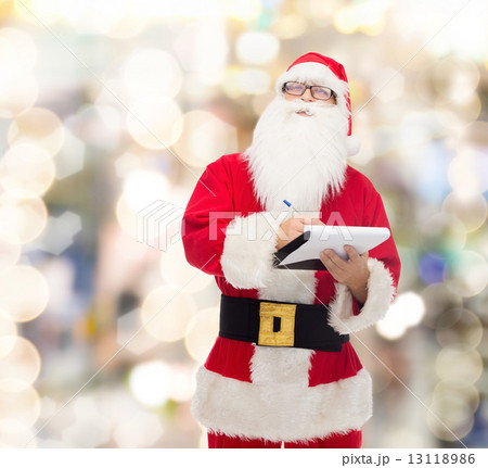 man in costume of santa claus with notepad man in costume of santa claus with notepad 13118986
