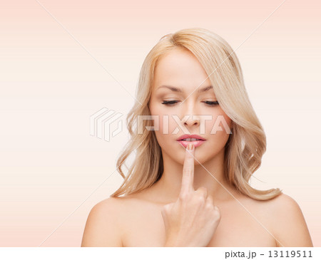 beutiful young woman touching her lips 13119511