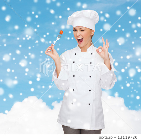 smiling female chef with fork showing ok sign smiling female chef with fork showing ok sign 13119720