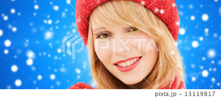 close up of smiling young woman in winter clothes close up of smiling young woman in winter clothes 13119817