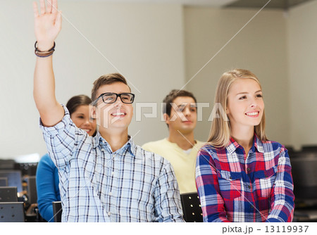 group of smiling students in lecture hall 13119937