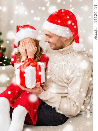 smiling father and daughter holding gift box 13120411