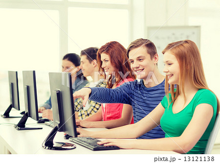 female student with classmates in computer class female student with classmates in computer class 13121138