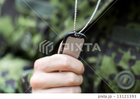 close up of young soldier in military uniform 13121393