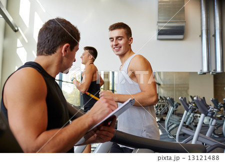 men exercising on treadmill in gym men exercising on treadmill in gym 13121488