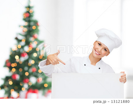 smiling female chef with white blank board smiling female chef with white blank board 13121880