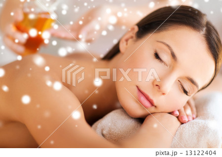 beautiful young woman in spa salon getting massage 13122404