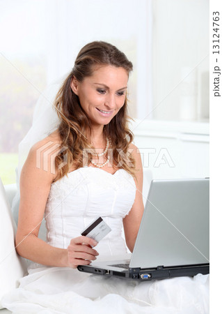 Bride doing online shopping at home Bride doing online shopping at home 13124763