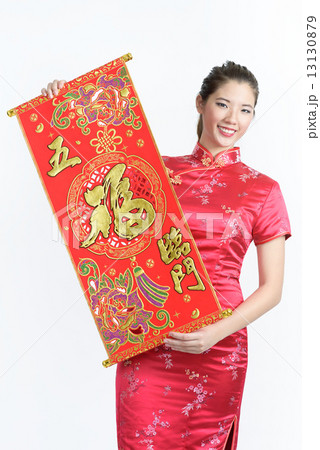One young Chinese woman in cheongsam holding wu fu lin men red banner in isolated white background 13130879