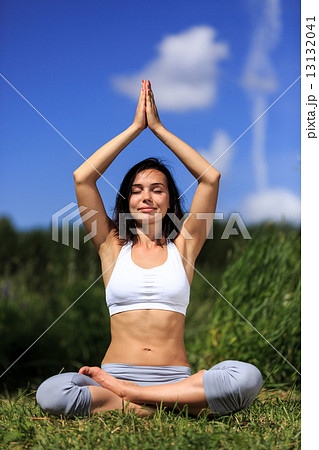 Young woman doing yoga outdoor 13132041