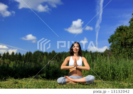 Young woman doing yoga outdoor 13132042