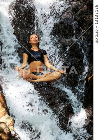 Young Happy Woman Doing Meditating in Lotus Position 13132126