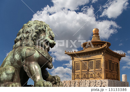 Bronze Guardian Lion Statue and bronze pagoda in the Forbidden City, Beijing, China Bronze Guardian Lion Statue and bronze pagoda in the Forbidden City, Beijing, China 13133386