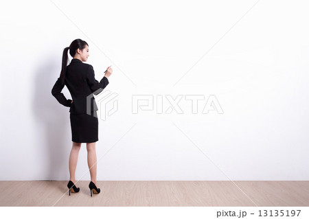 business woman writing 13135197
