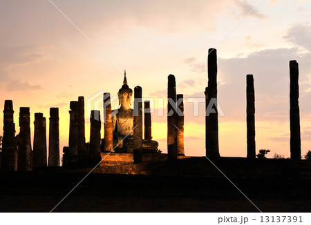 Ancient buddha statue at twilight, Wat Mahathat in Sukhothai His 13137391