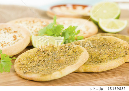 Zaatar & Cheese Manakish - Flatbreads topped with zaatar and olive oil and cheese. Traditional Arab  13139885