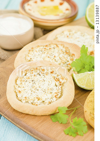Cheese Manakish - Flatbread topped with cheese. Traditional Arab food. 13139887