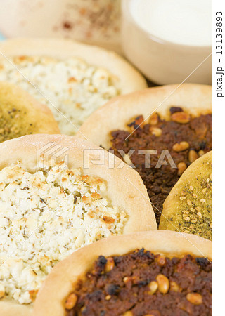 Lahm Bi Ajin, Zaatar and Cheese Manakish - Flatbreads topped with minced lamb, cheese and zaatar.  13139893
