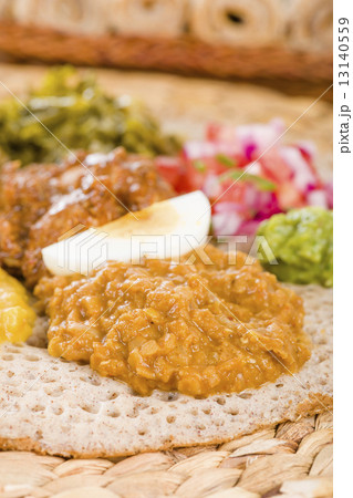 Ethiopian Feast - Injera with doro wat, yebeg alicha, misir wat, kik alicha, and gomen Ethiopian Feast - Injera with doro wat, yebeg alicha, misir wat, kik alicha, and gomen 13140559